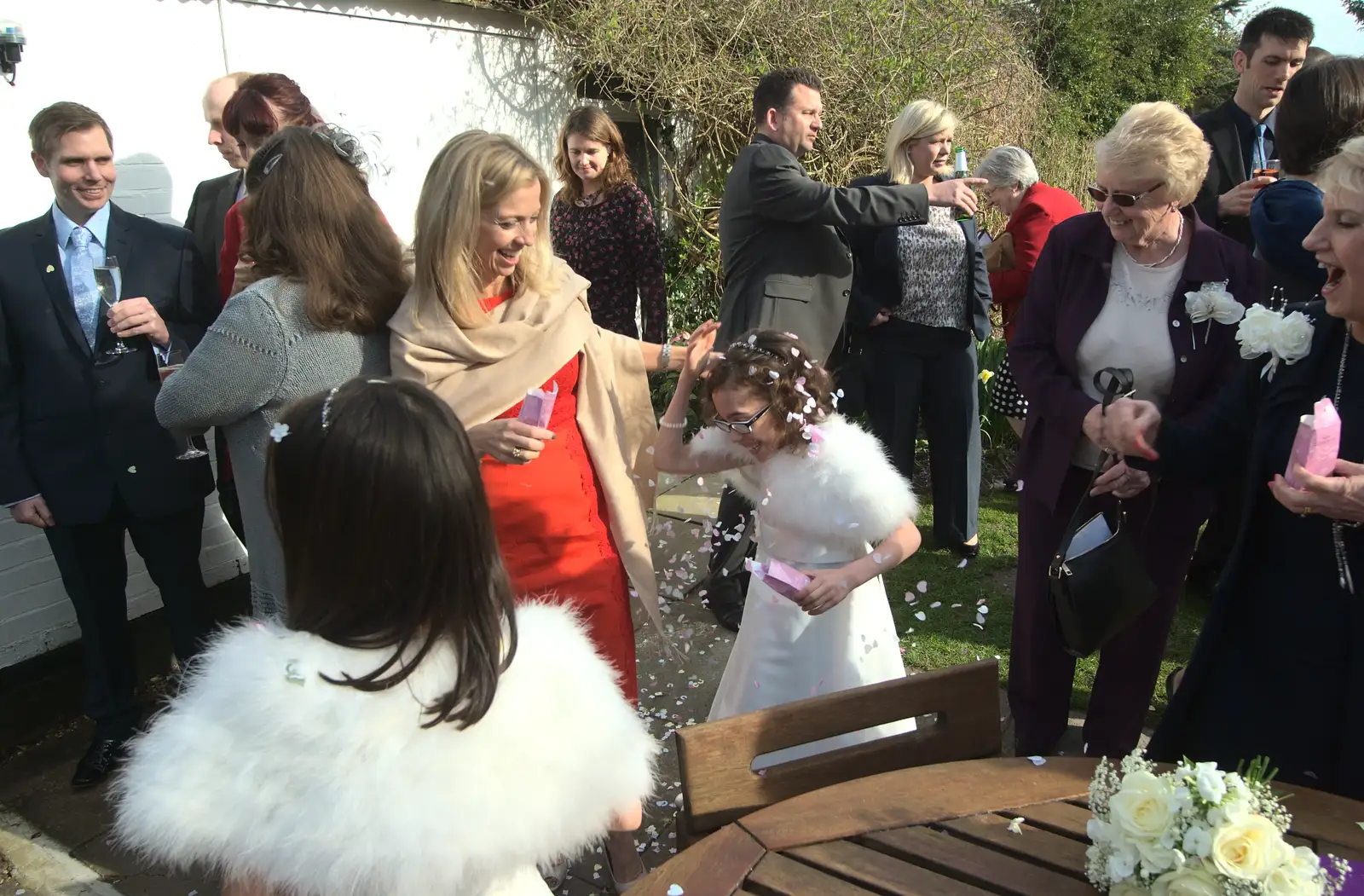 Confetti is hurled about, from John and Caroline's Wedding, Sheene Mill, Melbourne, Cambridgeshire - 8th March 2014