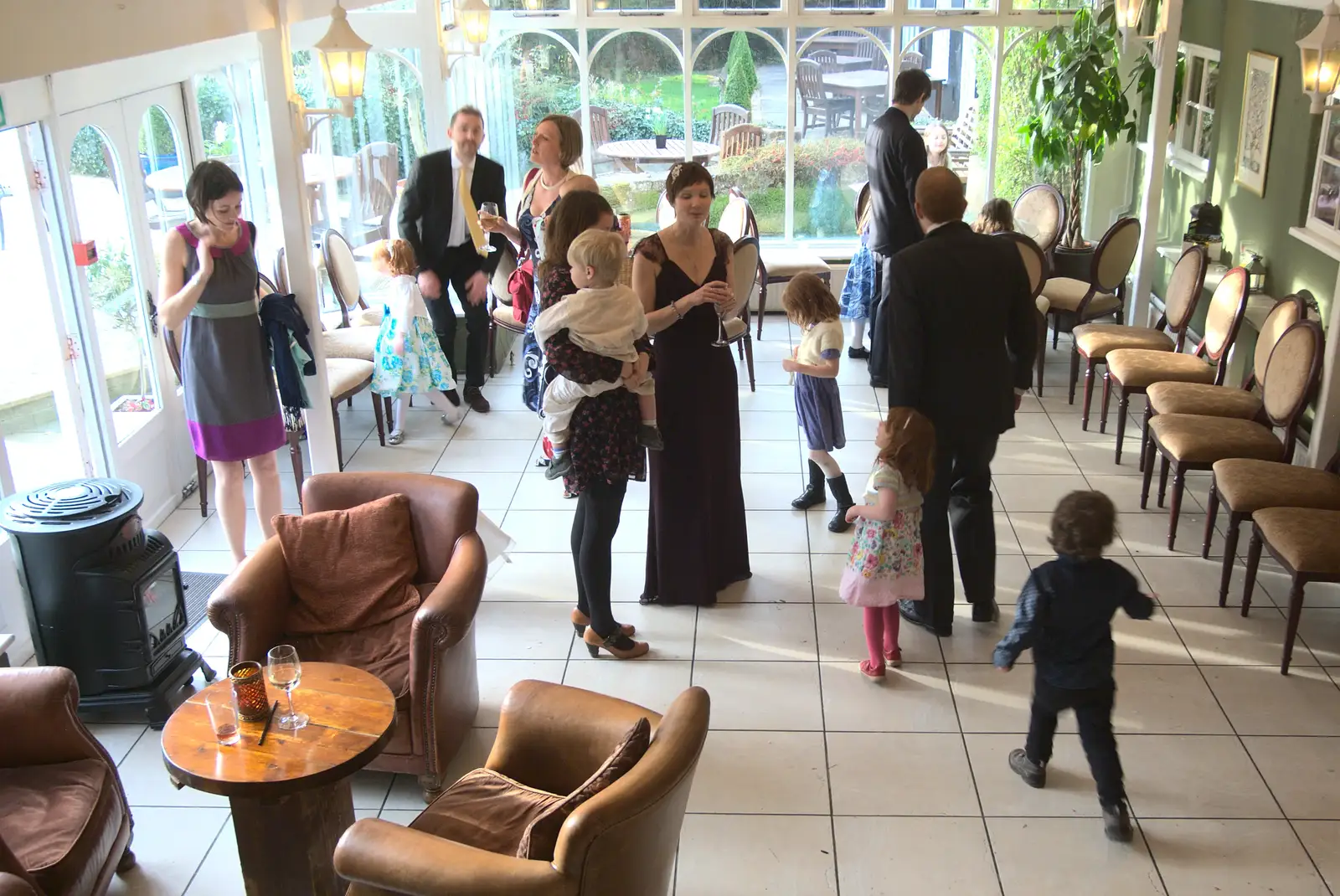 Mingling in the conservatory, from John and Caroline's Wedding, Sheene Mill, Melbourne, Cambridgeshire - 8th March 2014