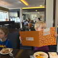 Harry checks out the breakfast menu at the Hotel, A Day Out at Duxford, Cambridgeshire - 9th March 2014