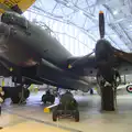 Isobel and Harry under a mighty Lancaster bomber, A Day Out at Duxford, Cambridgeshire - 9th March 2014