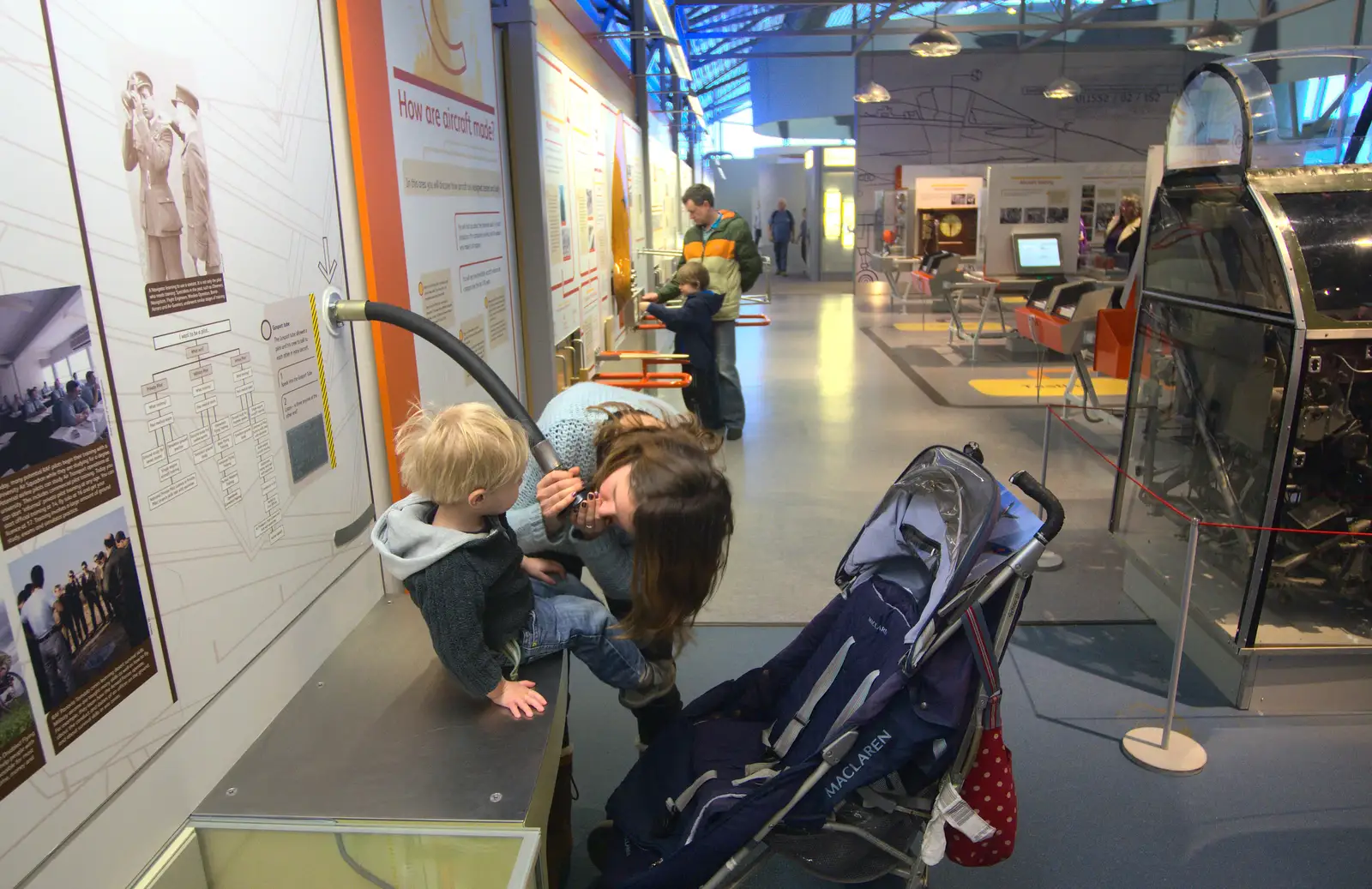 Harry sits on an exhibit, from A Day Out at Duxford, Cambridgeshire - 9th March 2014