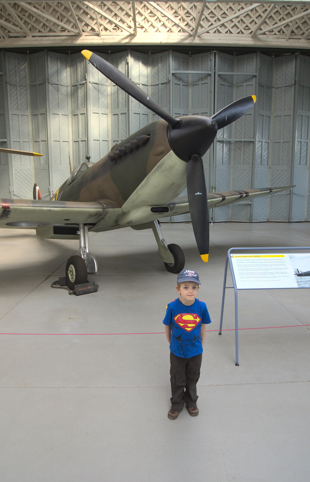 Fred stands in front of a Spitfire from A Day Out at Duxford, Cambridgeshire - 9th March 2014