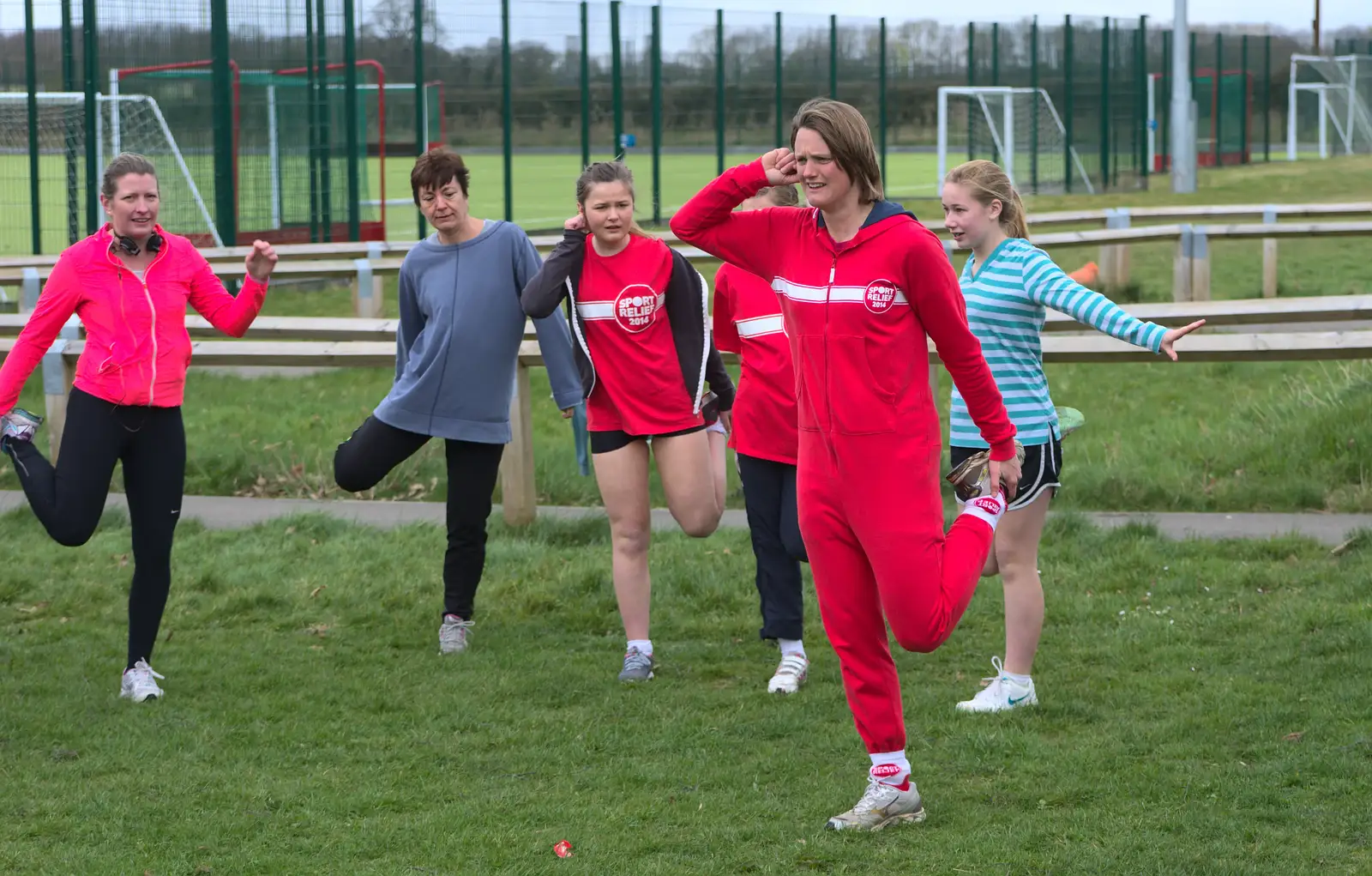 Some bizarre ear pulling, from Isobel's Fun Run, Hartismere High, Eye, Suffolk - 23rd March 2014