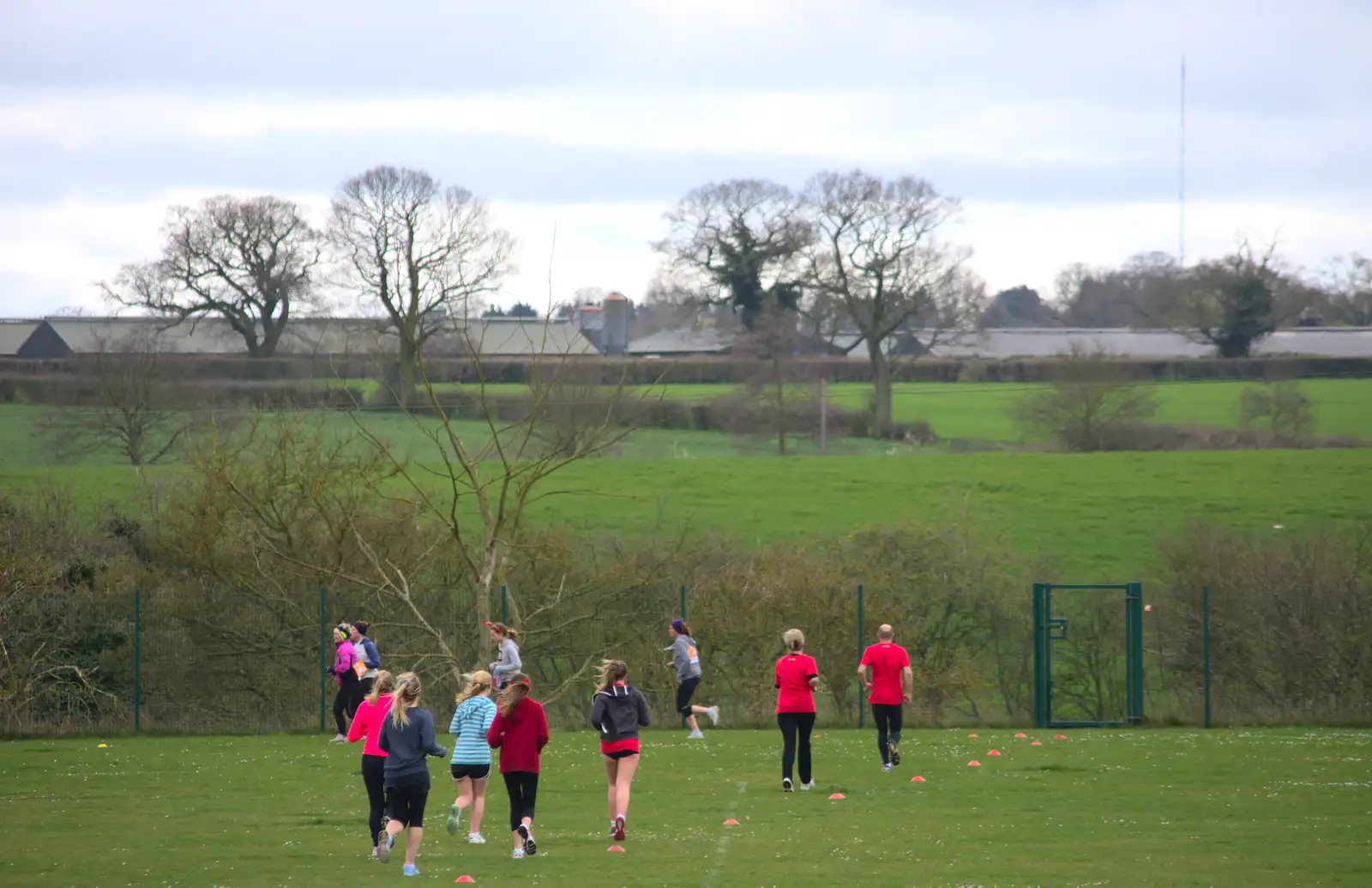 The runners trundle off towards Eye, from Isobel's Fun Run, Hartismere High, Eye, Suffolk - 23rd March 2014