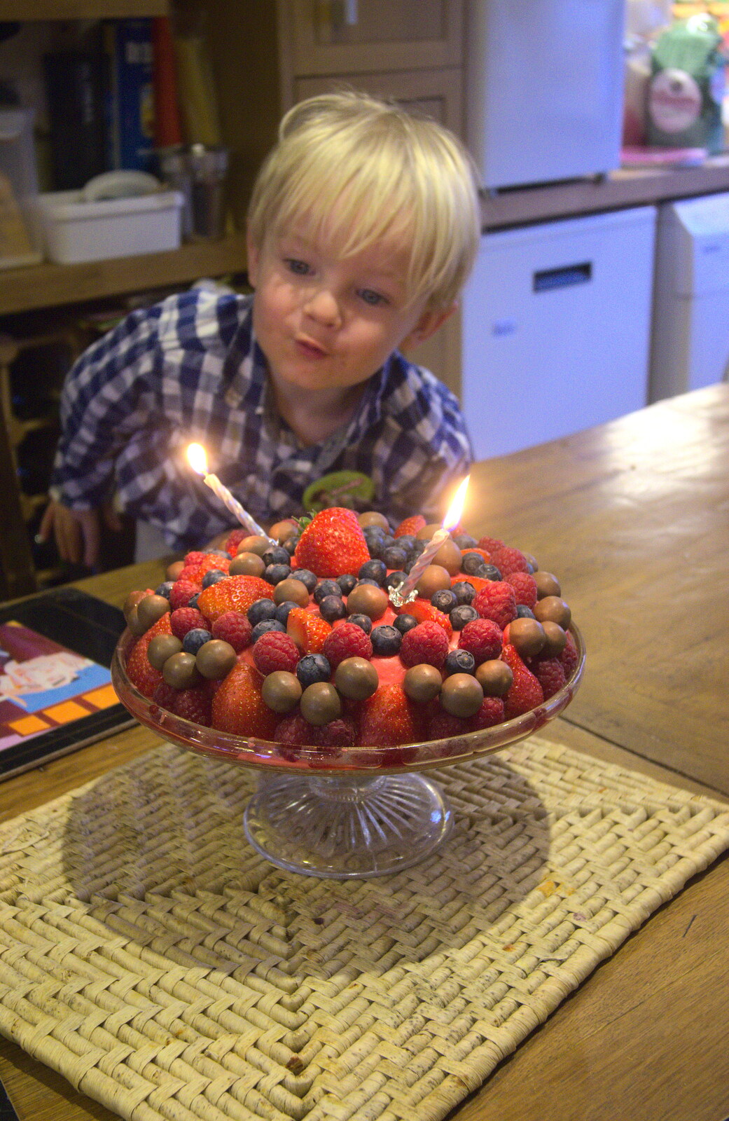 Harry gets in to blow the candles out from On Being Two: Harry's Birthday, Brome, Suffolk - 28th March 2014