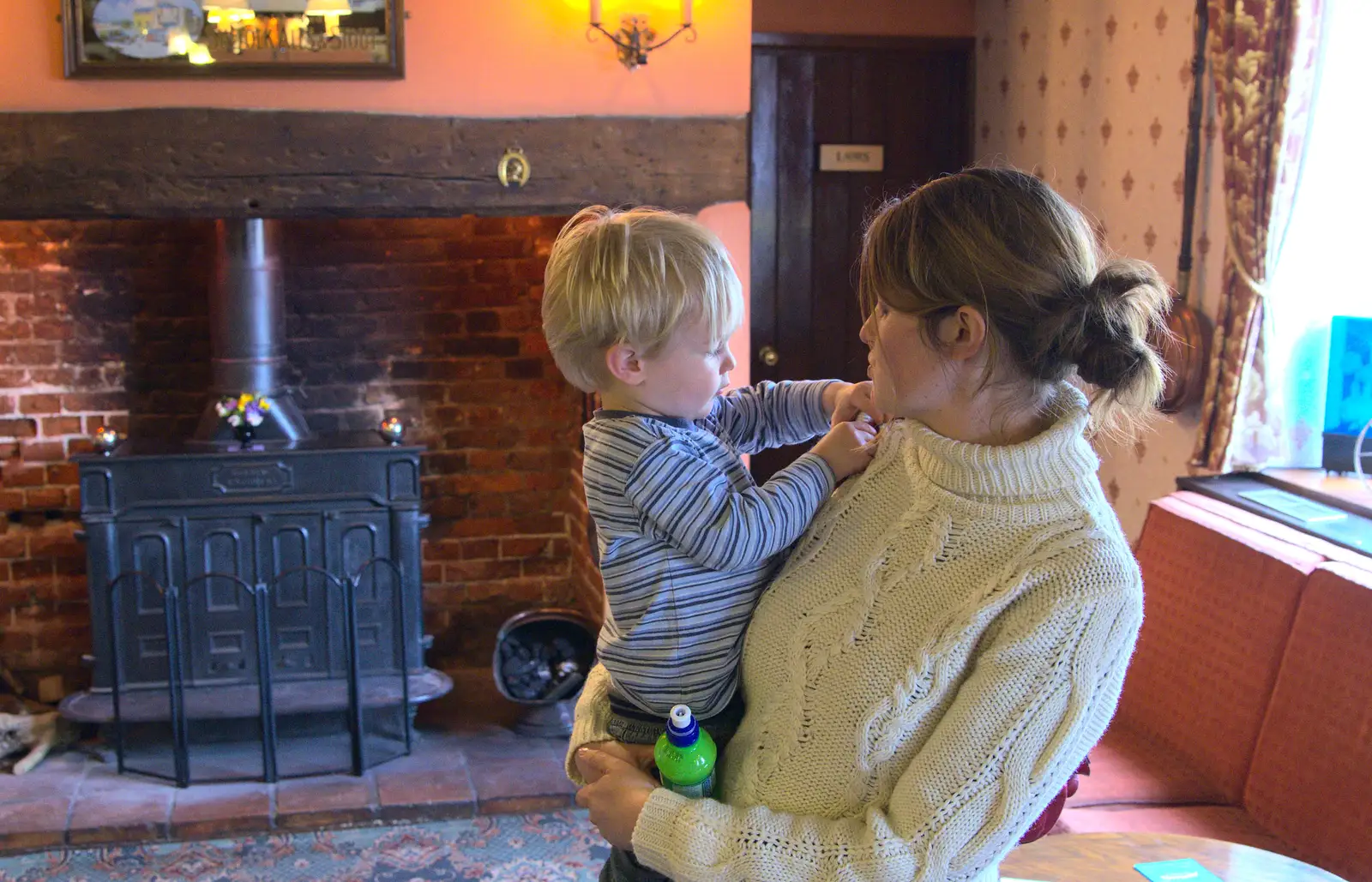 Harry gets a cuddle in the Swan, from On Being Two: Harry's Birthday, Brome, Suffolk - 28th March 2014