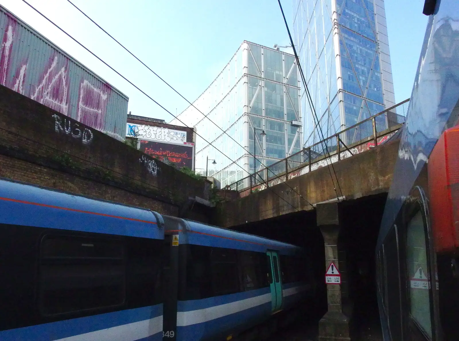 Trains get close as they pass under a bridge, from A Trainey Sort of Week, Liverpool Street, City of London - 3rd April 2014