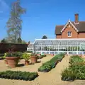 A greenhouse and a load of plants laid out, A Trip to Audley End House, Saffron Walden, Essex - 16th April 2014