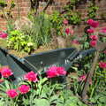 A wheelbarrow is overgrown with flowers, A Trip to Audley End House, Saffron Walden, Essex - 16th April 2014