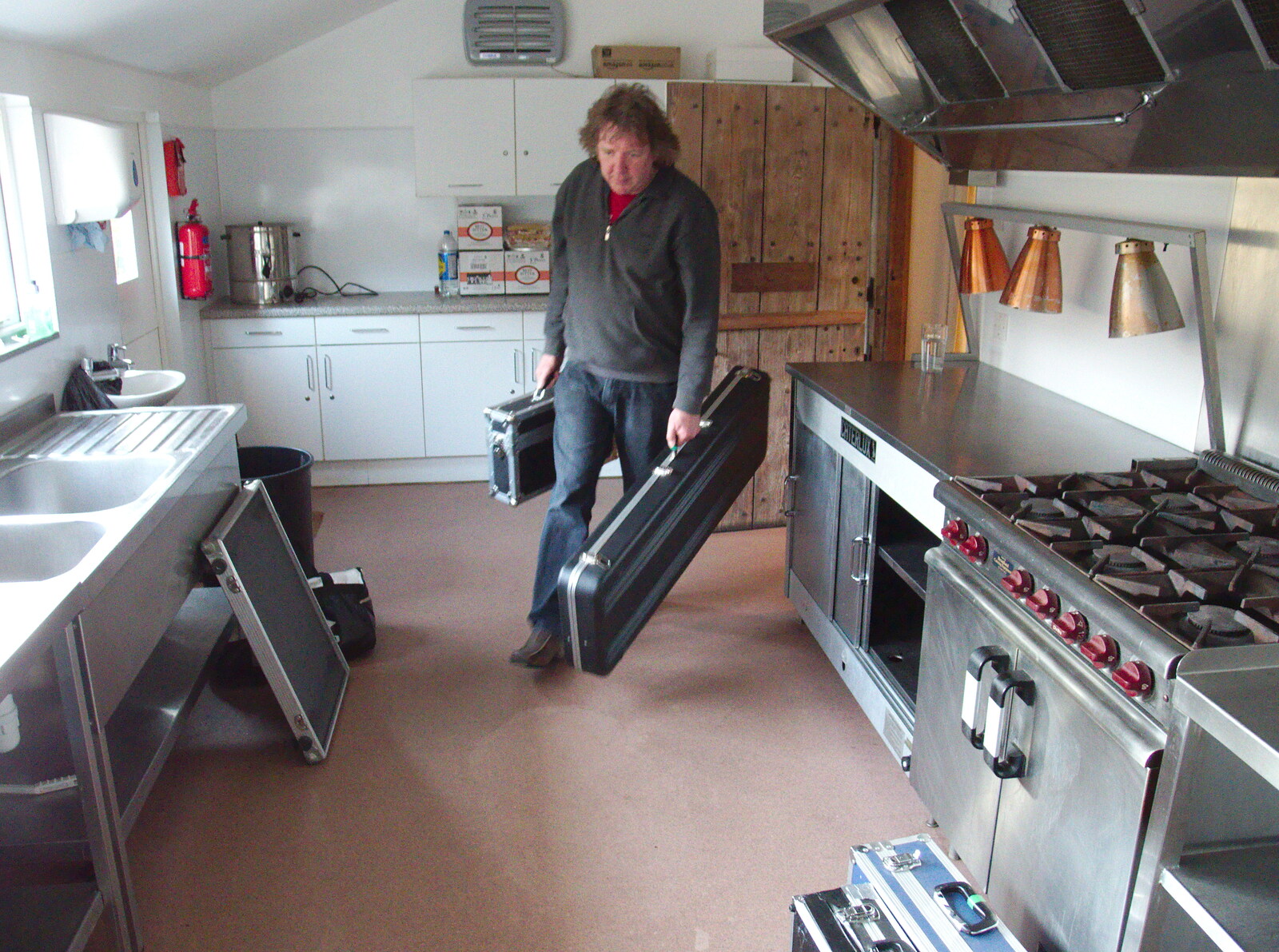Max hauls his cases through the kitchen from The BBs Play Haughley Park Barn, Haughley, Suffolk - 26th April 2014