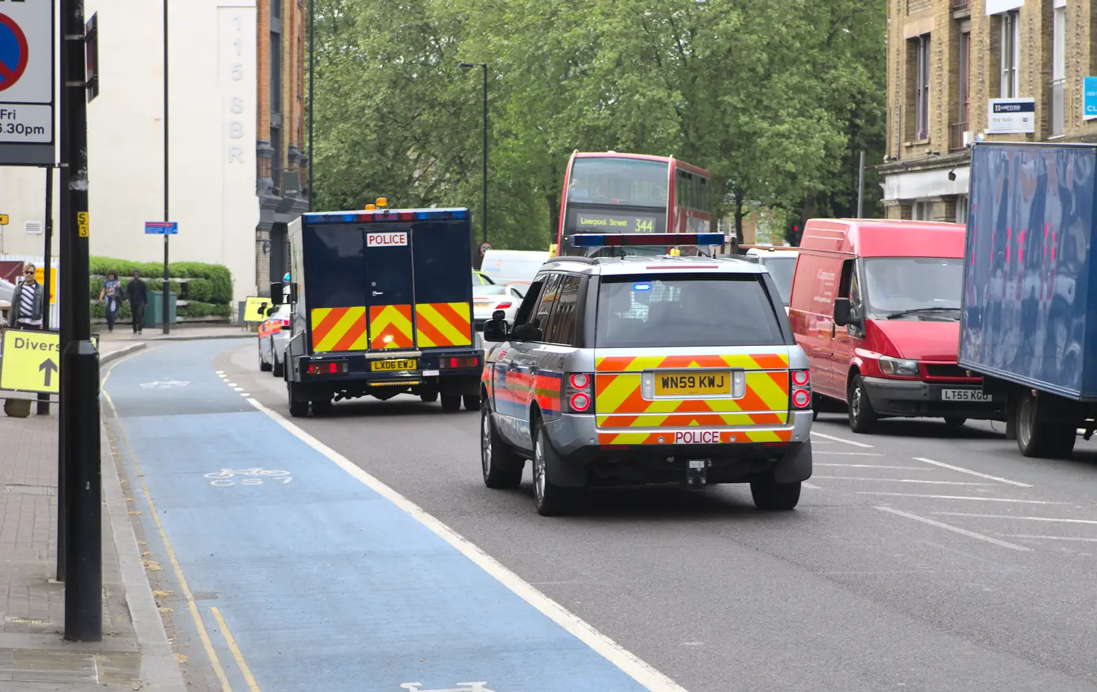 A convoy of rozzers steams up the road, from Brantham Dereliction, and a SwiftKey Photoshoot, Suffolk and Southwark - 29th April 2014