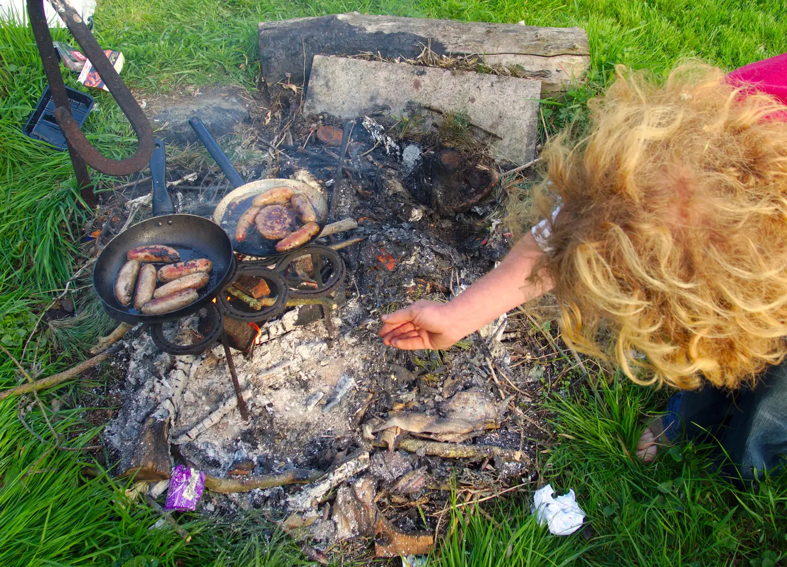 Wavy checks the fire, from BBs' Coldest Gig and a Wavy Barbeque, Botesdale and Stuston, Suffolk, 3rd May 2014