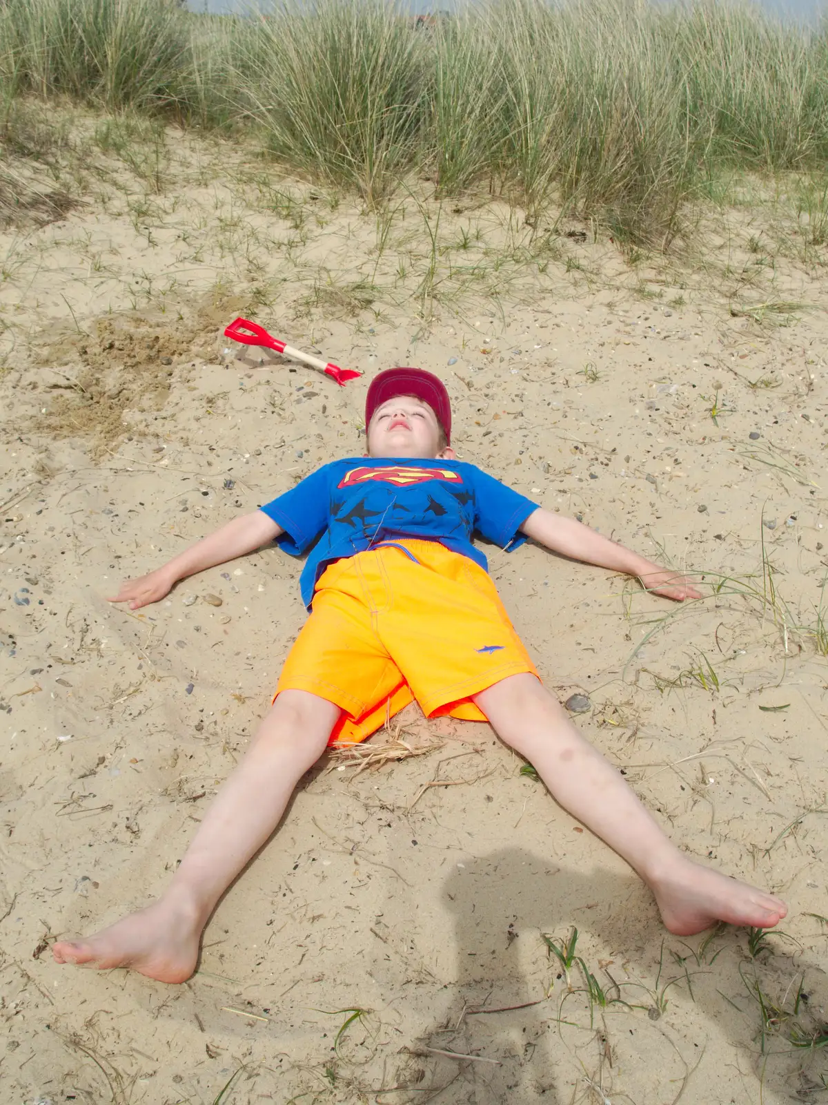 Fred does sand angels, from Life's A Windy Beach, Walberswick, Suffolk - 5th May 2014