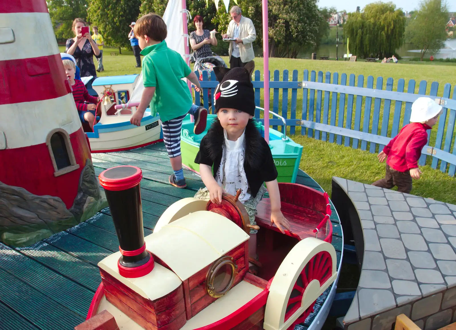 Harry's on a roundabout, from A Family Fun Day on the Park, Diss, Norfolk - 16th May 2014