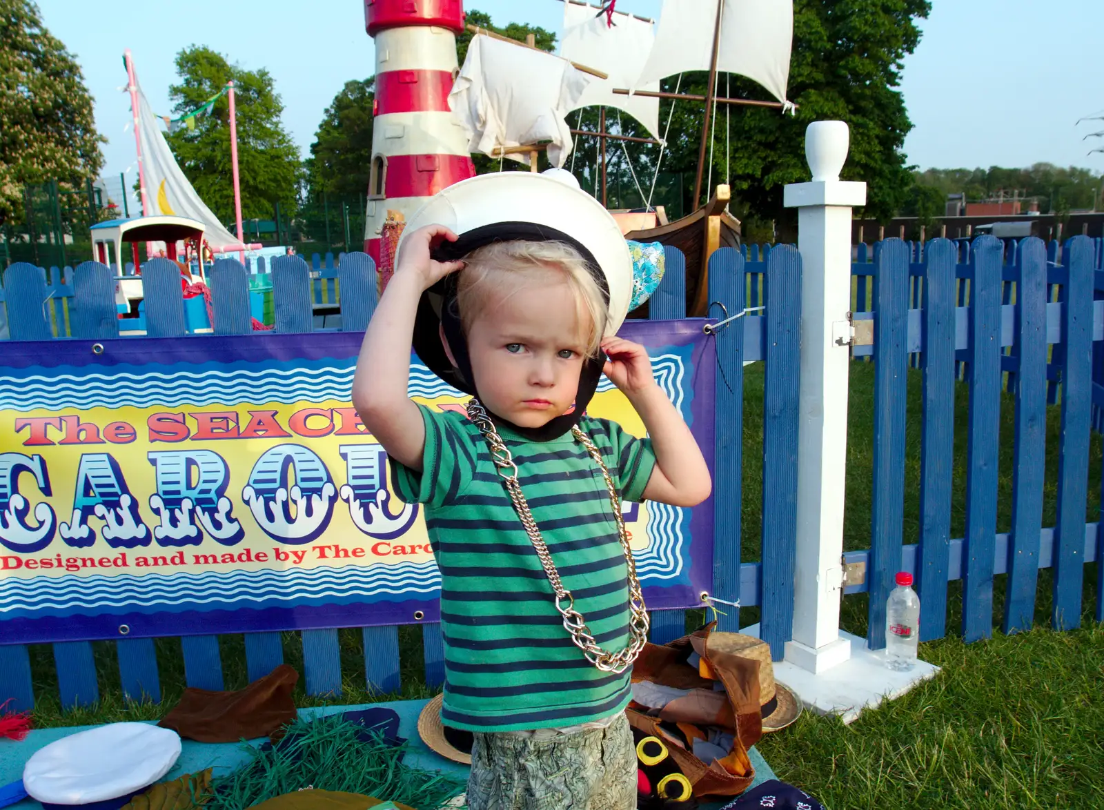 Harry tries a sailor hat on, from A Family Fun Day on the Park, Diss, Norfolk - 16th May 2014