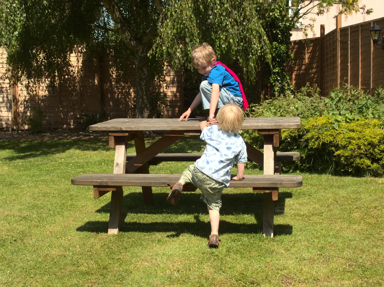 The boys climb on an empty table, from Thornham Four Horseshoes, and the Oaksmere, Brome, Suffolk - 17th May 2014