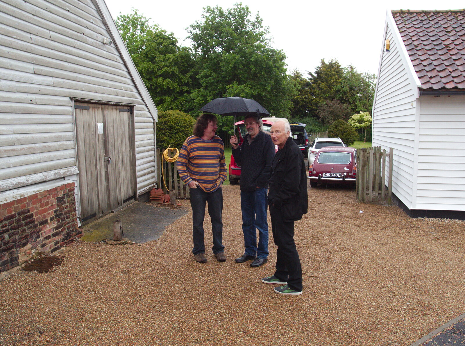 Max and Rob hide under an umbrella from The BBs Play Scrabble at Wingfield Barns, Wingfield, Suffolk - 24th May 2014