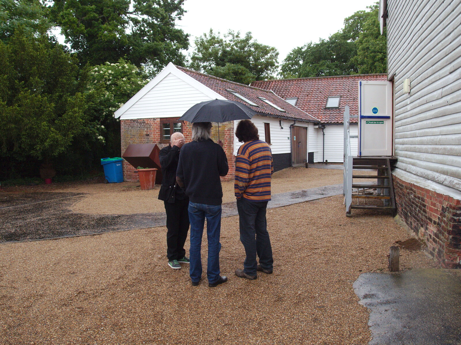 More under-umbrella action from The BBs Play Scrabble at Wingfield Barns, Wingfield, Suffolk - 24th May 2014