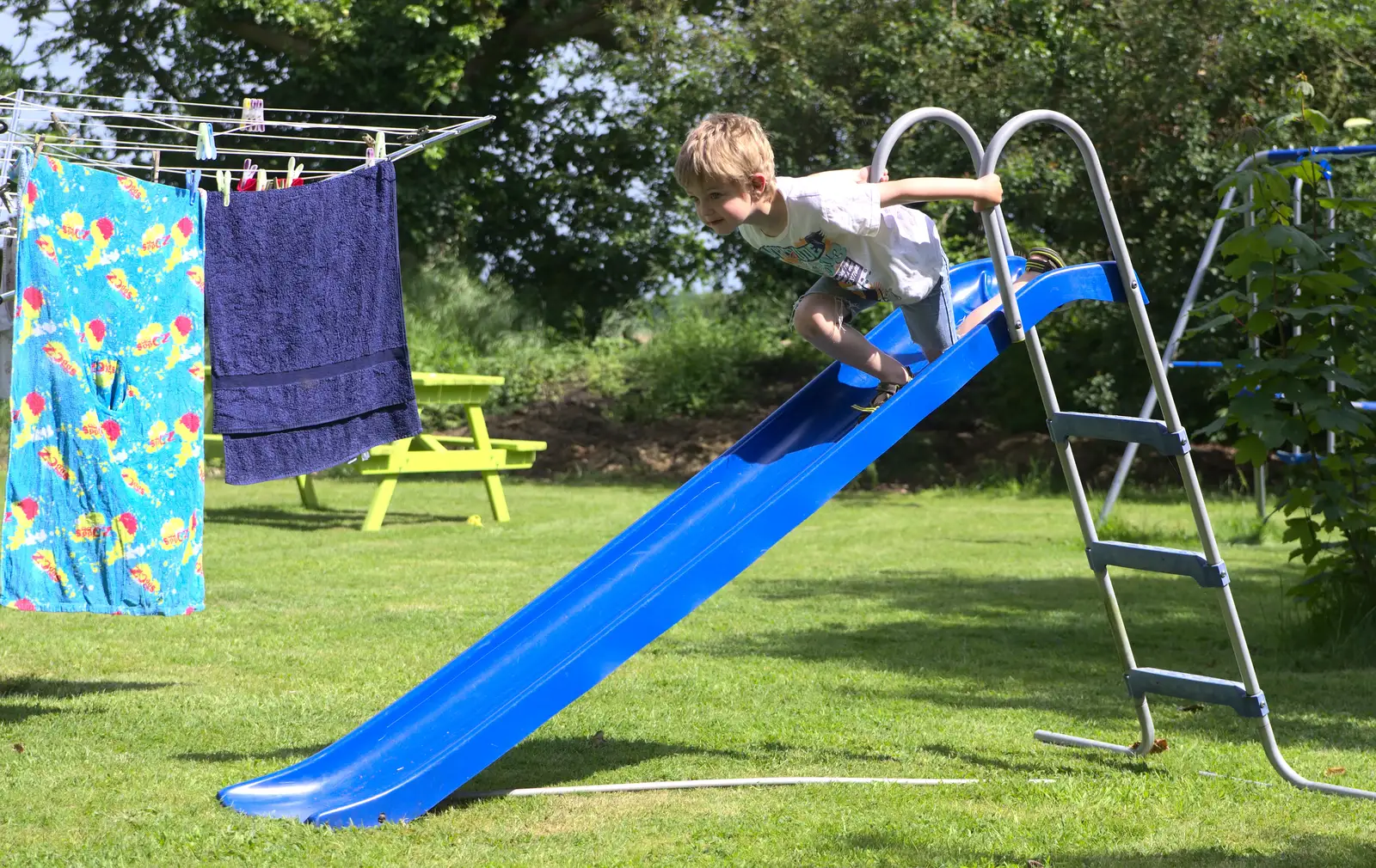 Fred hurls himself off a slide, from A "Not a Birthday Party" Barbeque, Brome, Suffolk - 25th May 2014