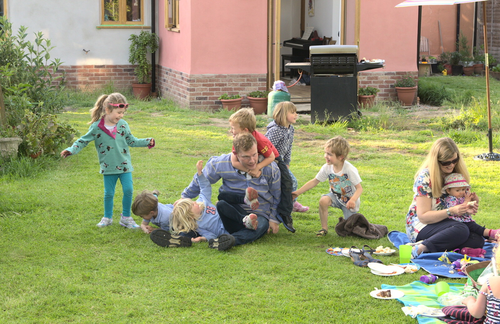 Mike busts out of the sprog pile from A "Not a Birthday Party" Barbeque, Brome, Suffolk - 25th May 2014