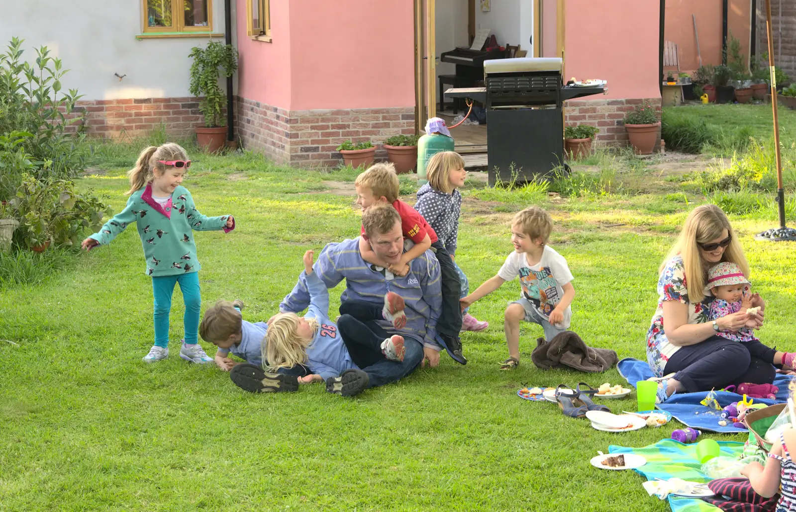 Mike busts out of the sprog pile, from A "Not a Birthday Party" Barbeque, Brome, Suffolk - 25th May 2014