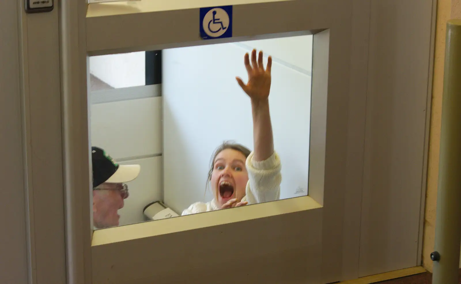 Isobel pretends that she's being eaten by the lift, from A Birthday Trip to the Zoo, Banham, Norfolk - 26th May 2014