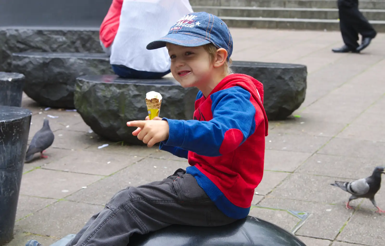 Fred points, with ice cream in hand, from Sis and Matt Visit, Suffolk and Norfolk - 31st May 2014