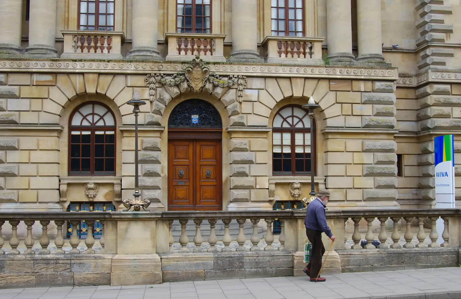 An dude walks past the old Norwich Union office, from Sis and Matt Visit, Suffolk and Norfolk - 31st May 2014