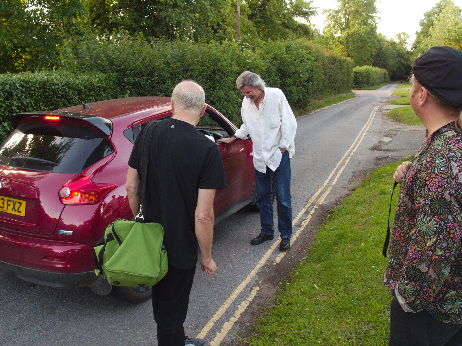 Rob chats to someone in a passing car from The BBs at Diss Rugby Club, Bellrope Lane, Roydon, Norfolk - 7th June 2014