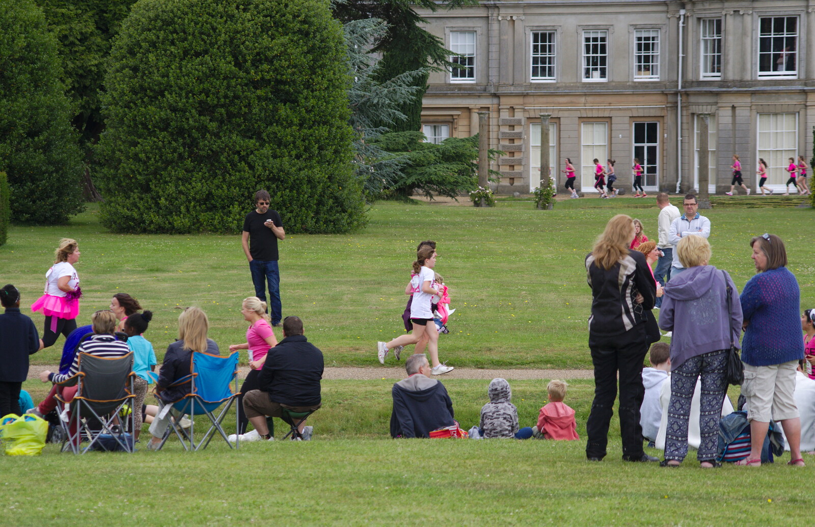 The first runners appear in front of the house from Isobel's Race For Life, Chantry Park, Ipswich - 11th June 2014