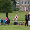The first runners appear in front of the house, Isobel's Race For Life, Chantry Park, Ipswich - 11th June 2014