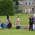 The first runners appear in front of the house, Isobel's Race For Life, Chantry Park, Ipswich - 11th June 2014