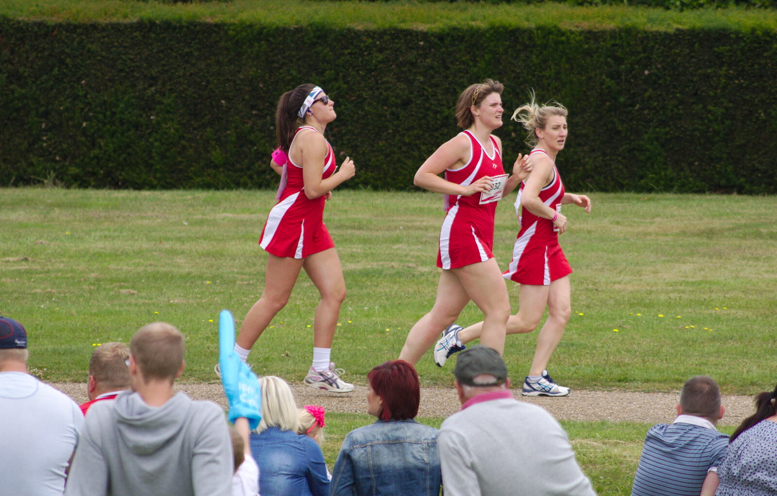 A netball team runs around from Isobel's Race For Life, Chantry Park, Ipswich - 11th June 2014
