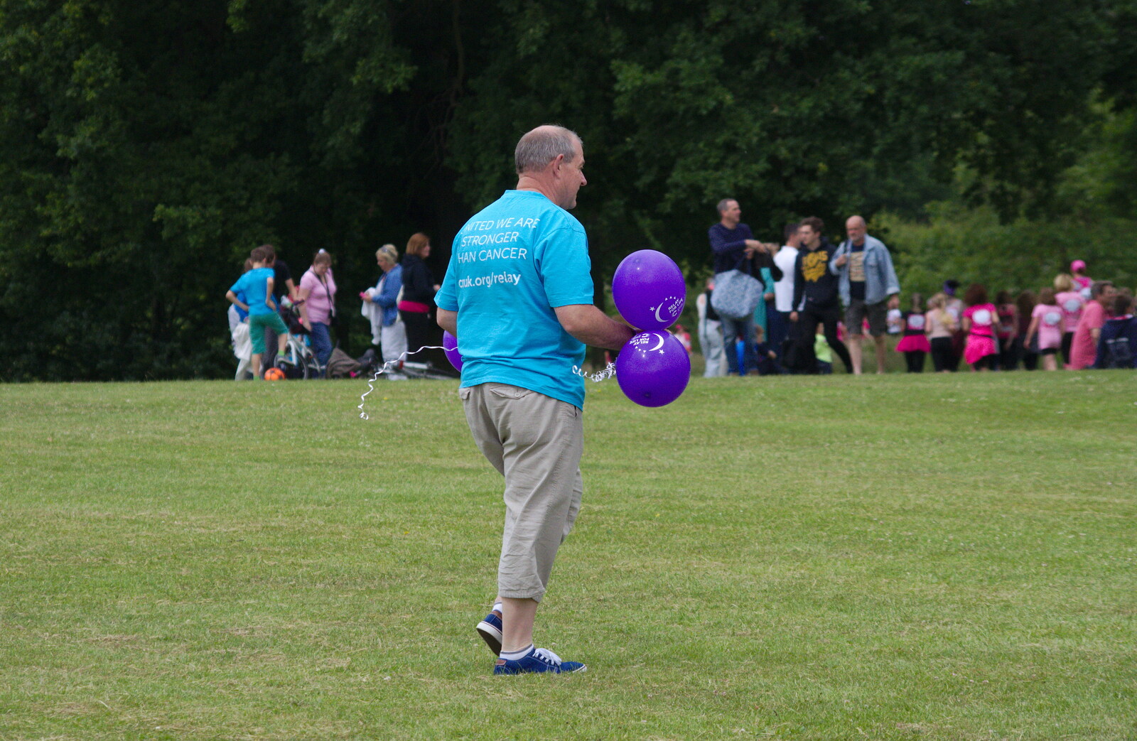 A bloke roams around with balloons from Isobel's Race For Life, Chantry Park, Ipswich - 11th June 2014