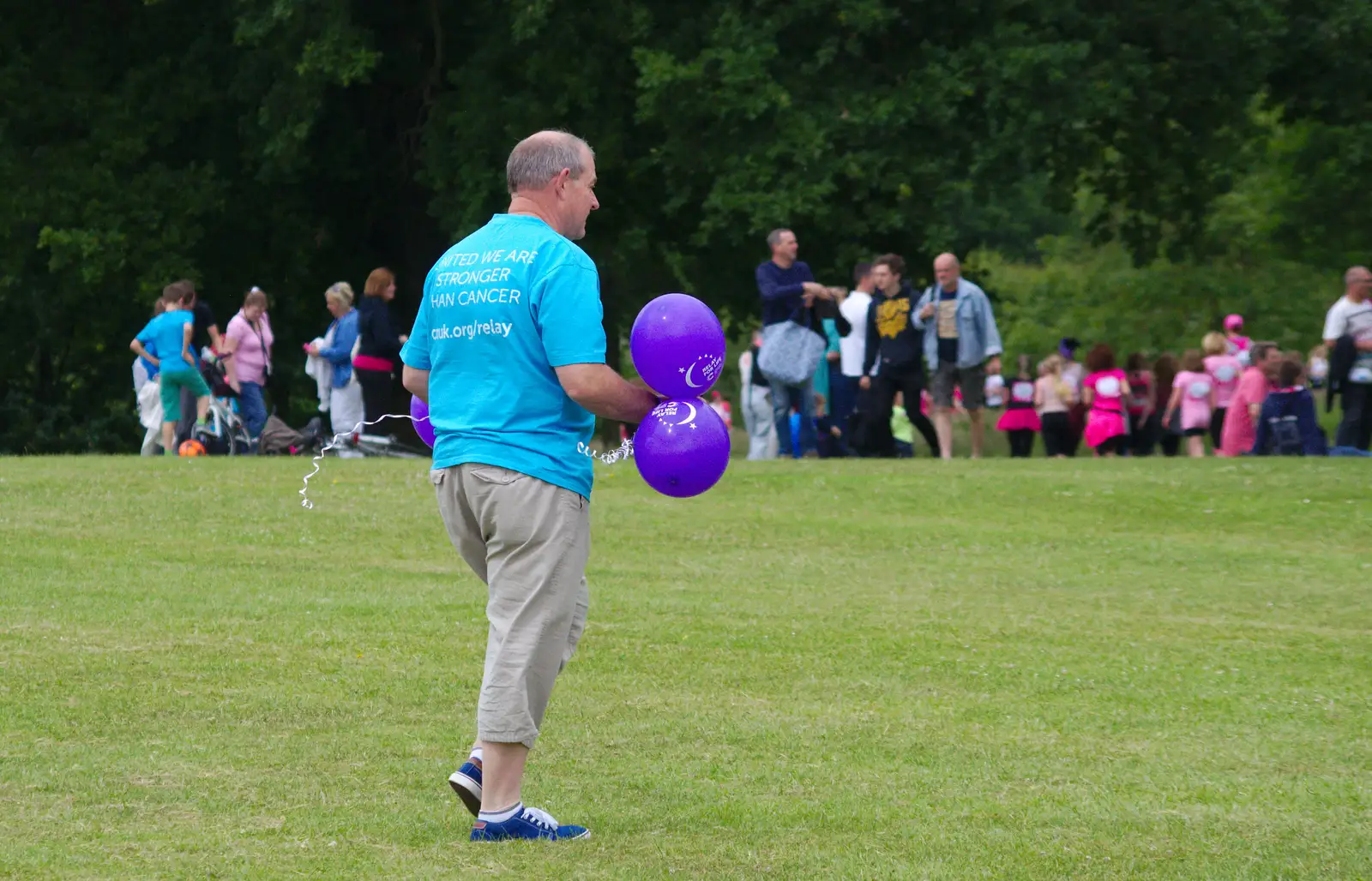 A bloke roams around with balloons, from Isobel's Race For Life, Chantry Park, Ipswich - 11th June 2014