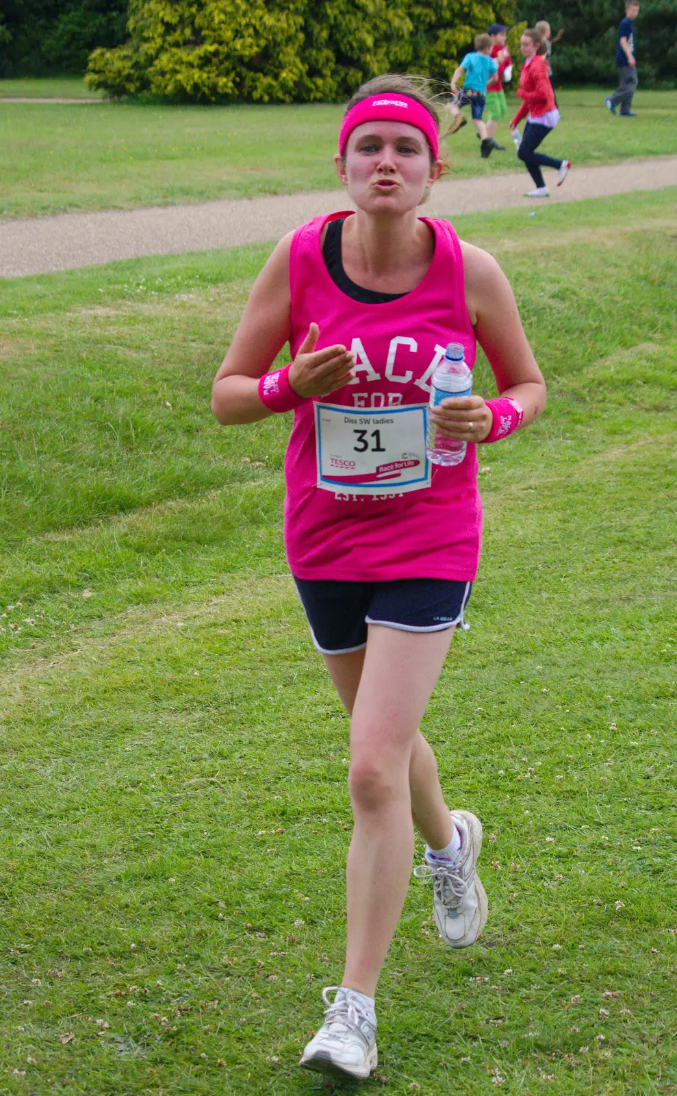 Isobel runs up for a kiss, from Isobel's Race For Life, Chantry Park, Ipswich - 11th June 2014