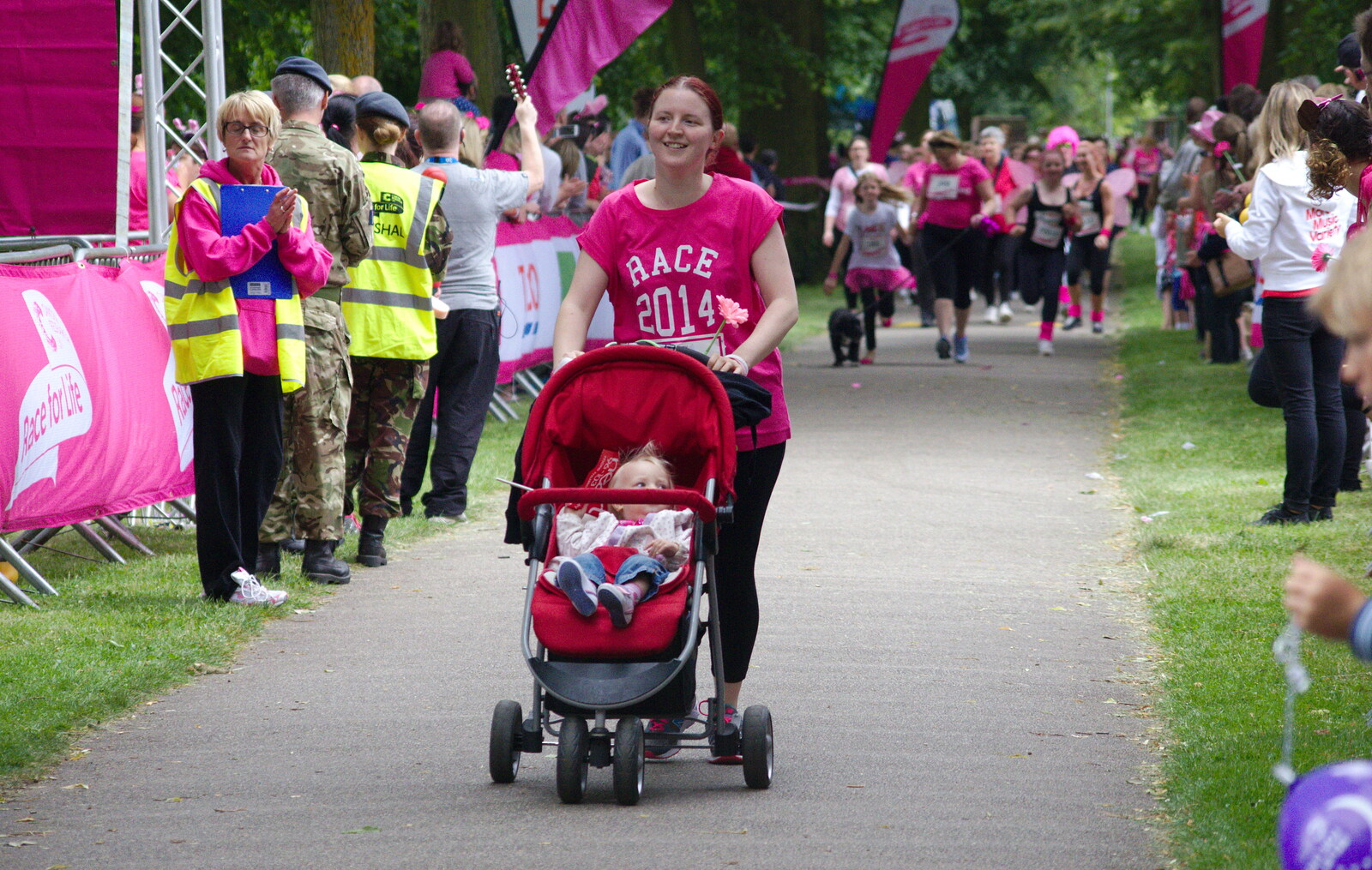 A buggy is pushed around from Isobel's Race For Life, Chantry Park, Ipswich - 11th June 2014