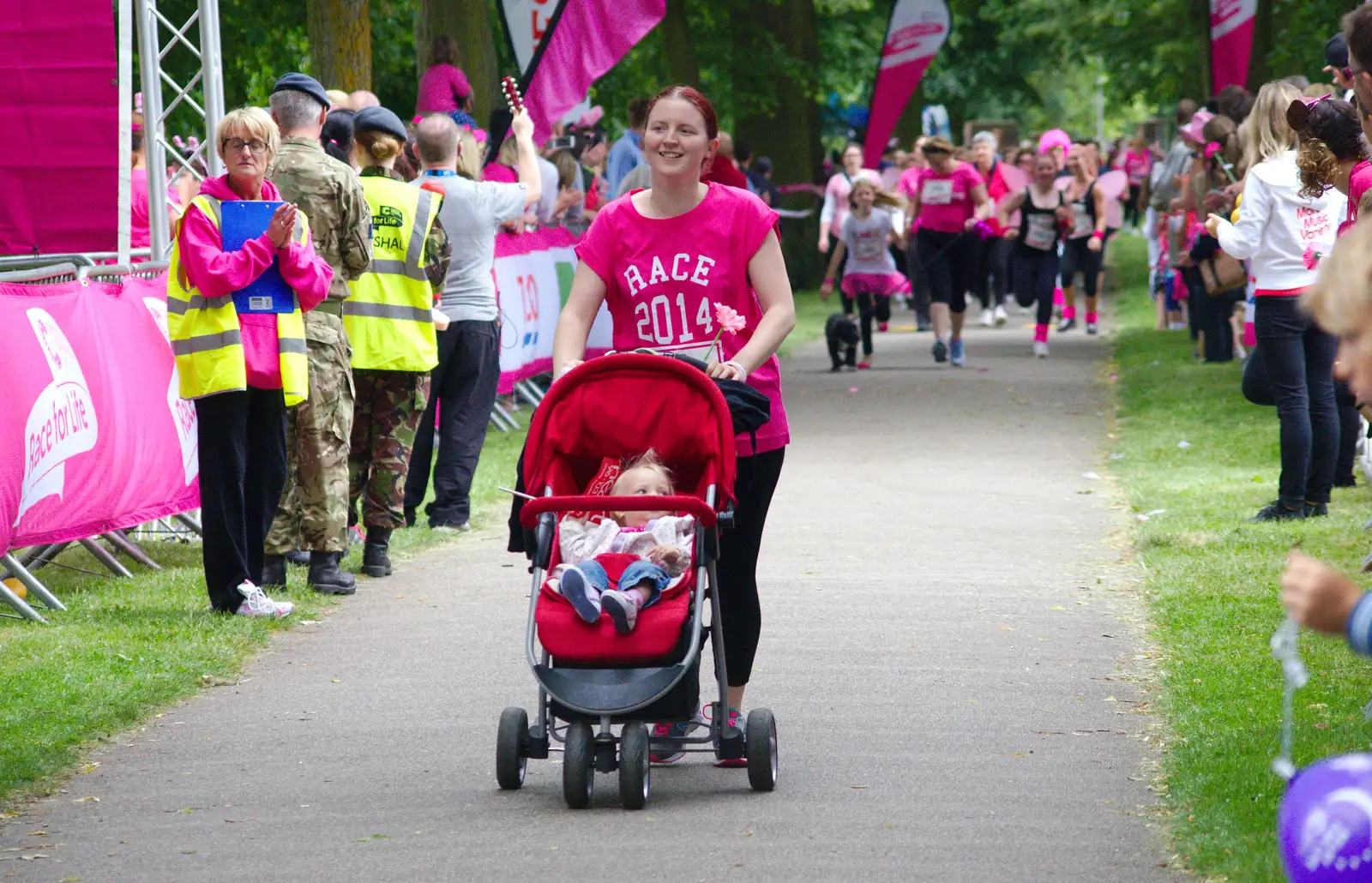 A buggy is pushed around, from Isobel's Race For Life, Chantry Park, Ipswich - 11th June 2014