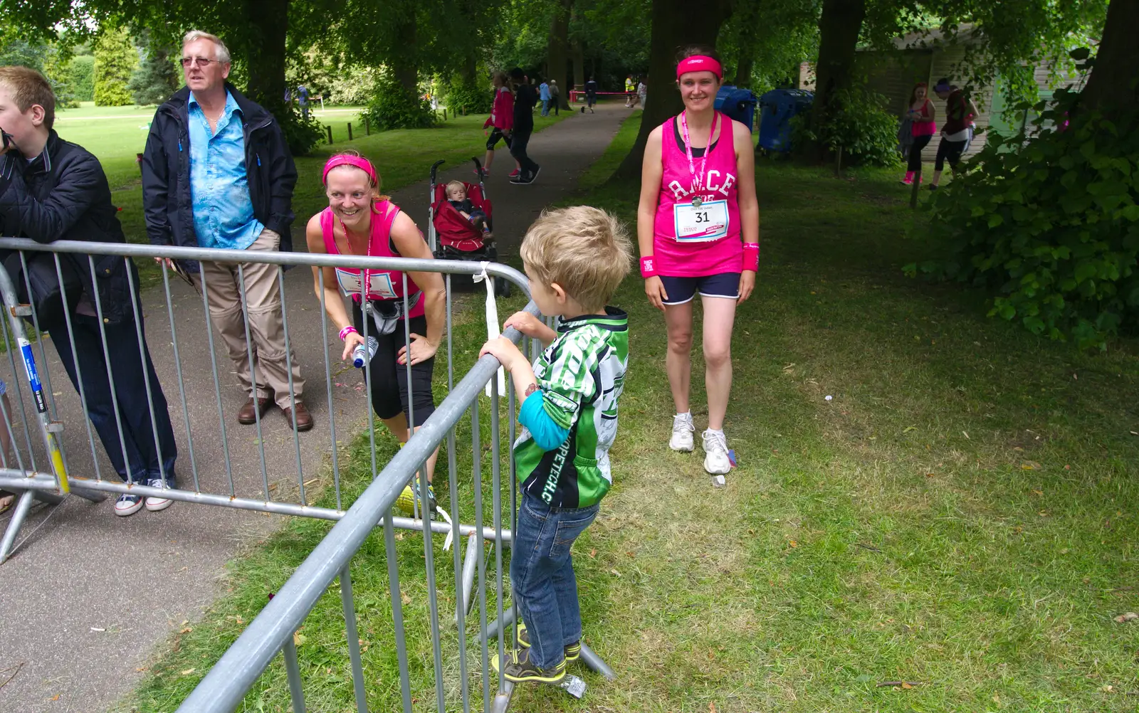 Fred climbs on a railing, from Isobel's Race For Life, Chantry Park, Ipswich - 11th June 2014