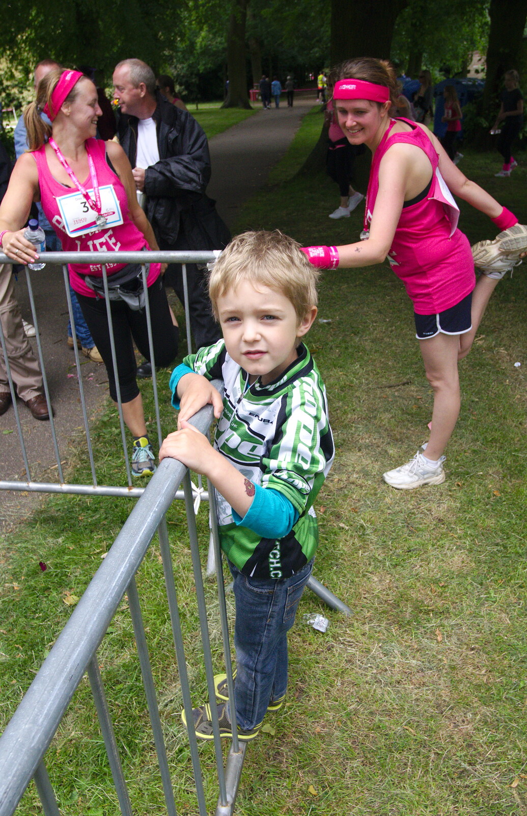 Fred looks on as some 'warm down' exercises occur from Isobel's Race For Life, Chantry Park, Ipswich - 11th June 2014