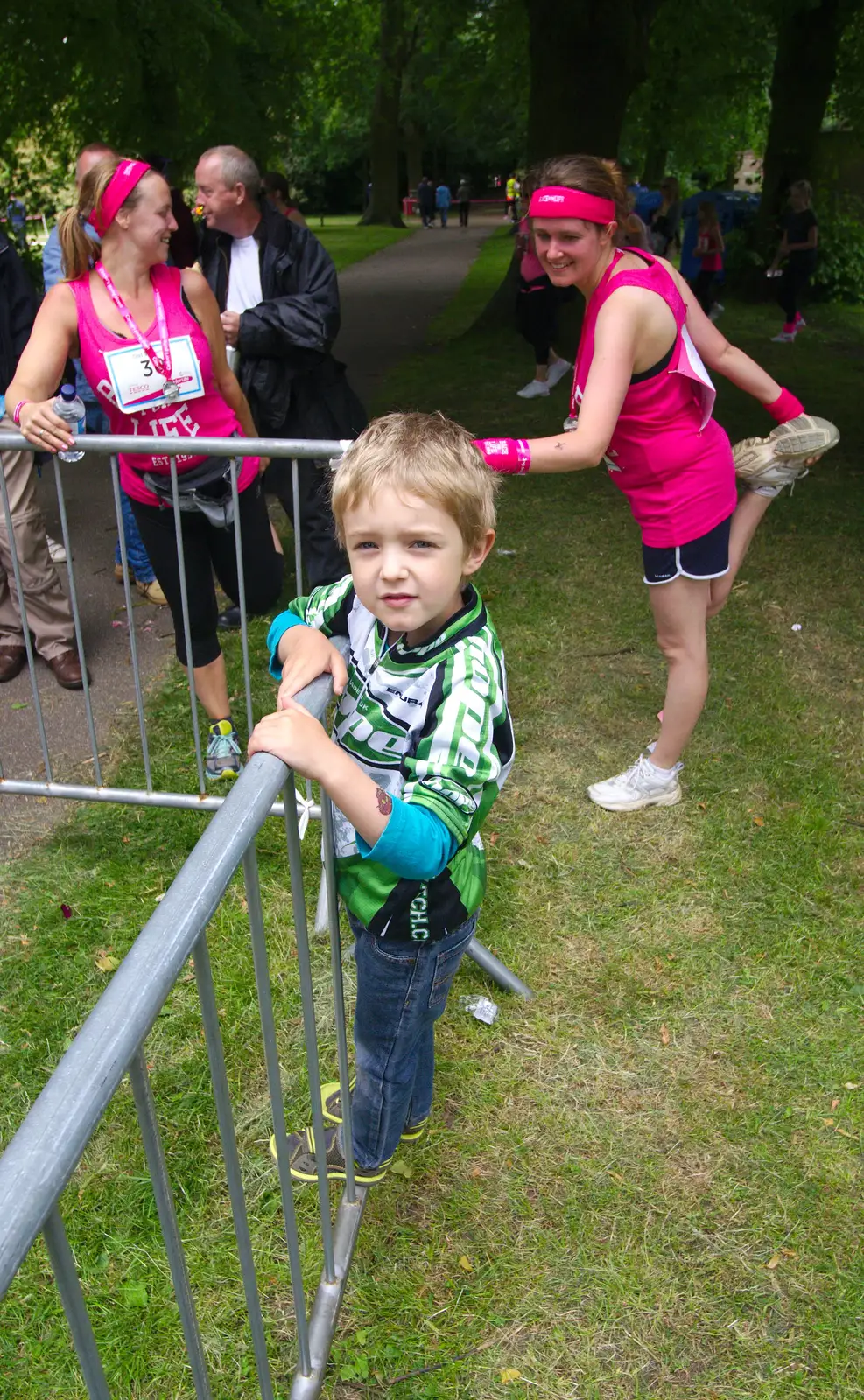 Fred looks on as some 'warm down' exercises occur, from Isobel's Race For Life, Chantry Park, Ipswich - 11th June 2014