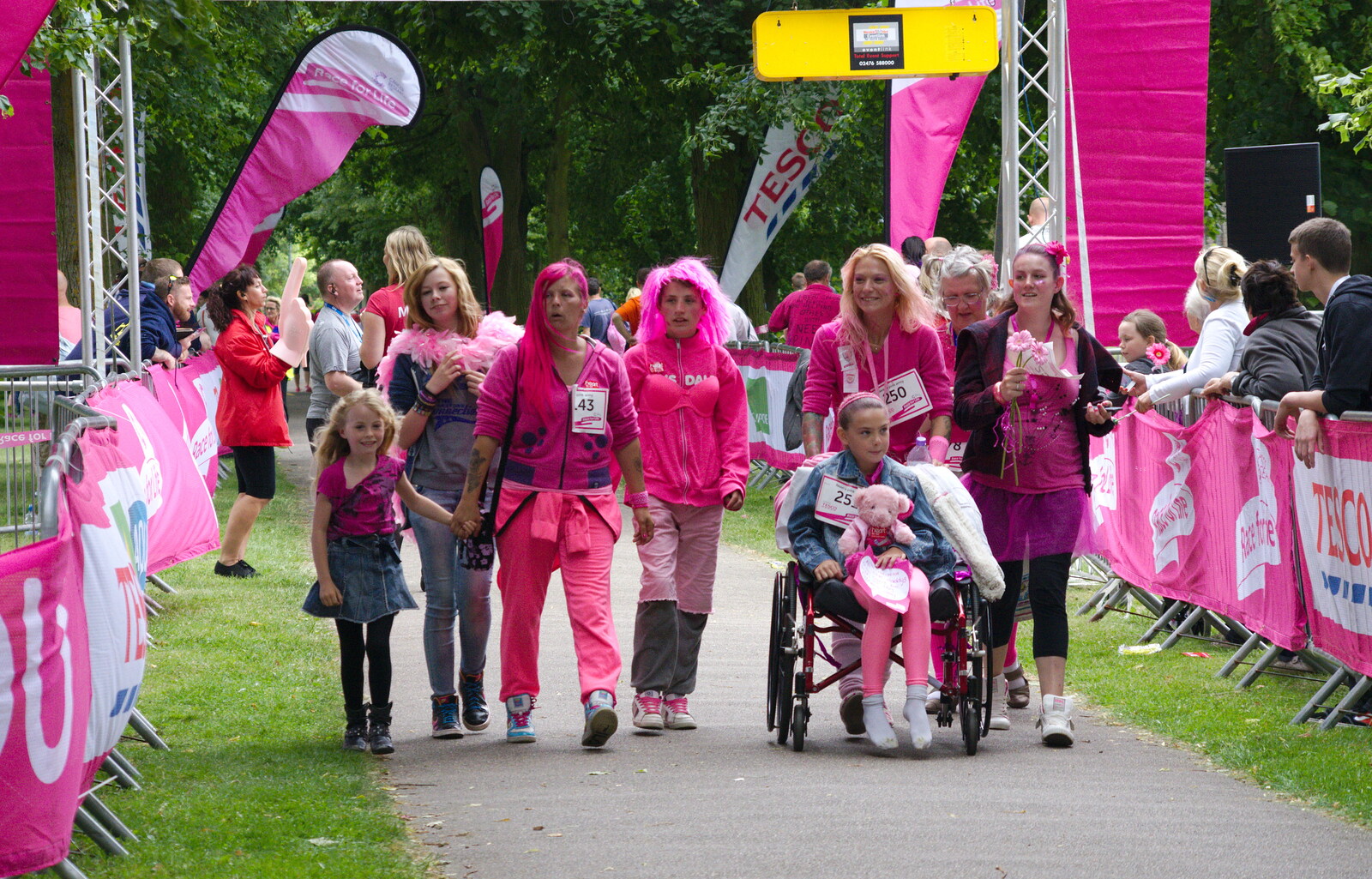 More walkers cross the line from Isobel's Race For Life, Chantry Park, Ipswich - 11th June 2014