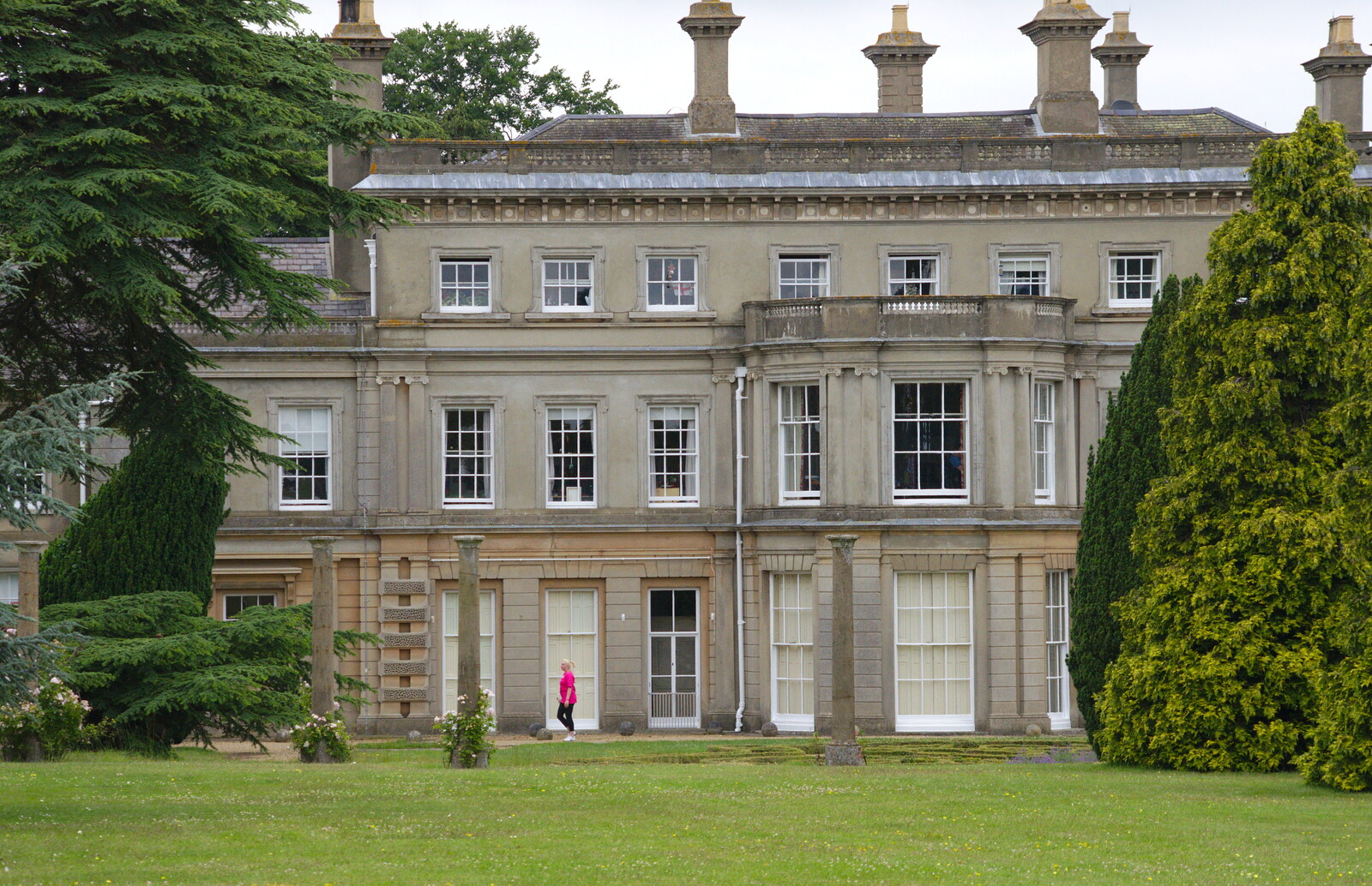 A lone walker trots past Chantry House from Isobel's Race For Life, Chantry Park, Ipswich - 11th June 2014