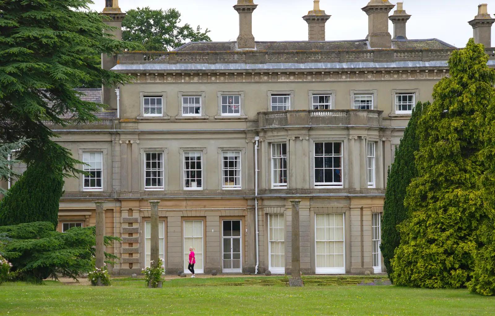 A lone walker trots past Chantry House, from Isobel's Race For Life, Chantry Park, Ipswich - 11th June 2014