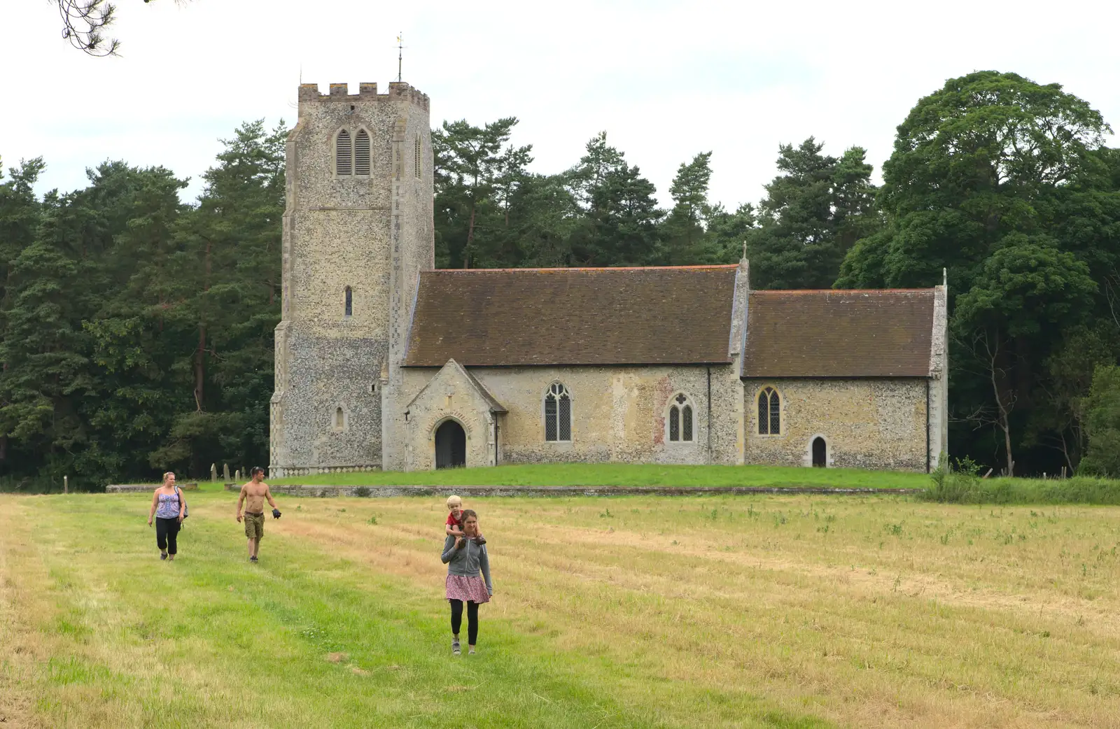 Isobel and Harry wander across the field, from A Weekend in the Camper Van, West Harling, Norfolk - 21st June 2014