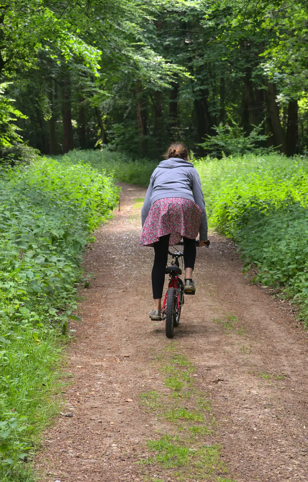 Isobel heads off on Fred's bike, from A Weekend in the Camper Van, West Harling, Norfolk - 21st June 2014