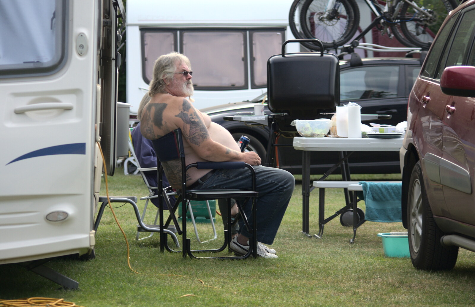 A tattooed dude does a can of Kronenbourg from A Weekend in the Camper Van, West Harling, Norfolk - 21st June 2014