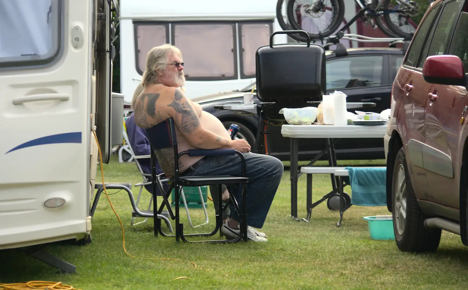 A tattooed dude does a can of Kronenbourg, from A Weekend in the Camper Van, West Harling, Norfolk - 21st June 2014