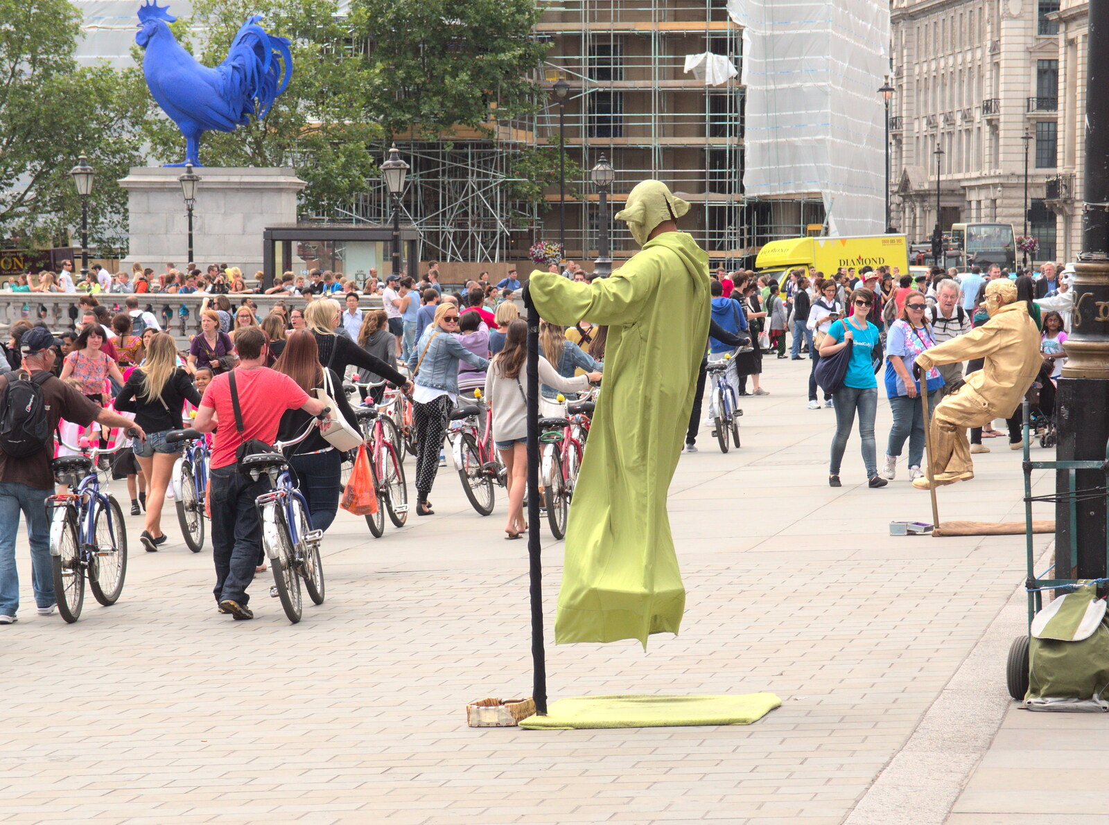 A 'Fat Tire' tour group passes a floating Yoda from SwiftKey Innovation Days, The Haymarket, London - 27th June 2014