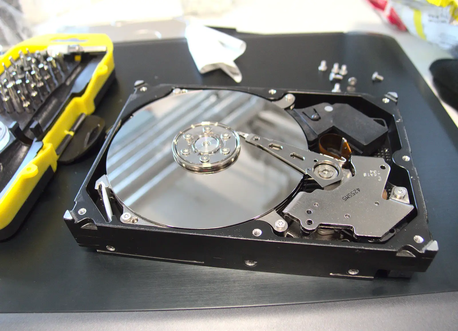 Nosher starts to dis-assemble a 750G hard drive, from SwiftKey Innovation Days, The Haymarket, London - 27th June 2014